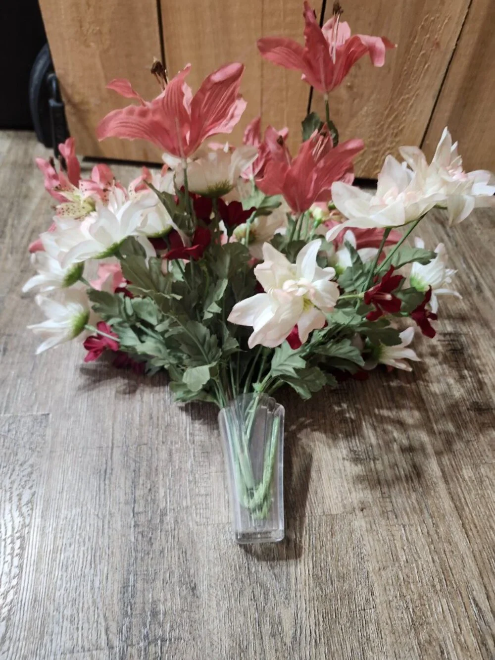 vintage floral arrangement of artificial flowers in small vase
